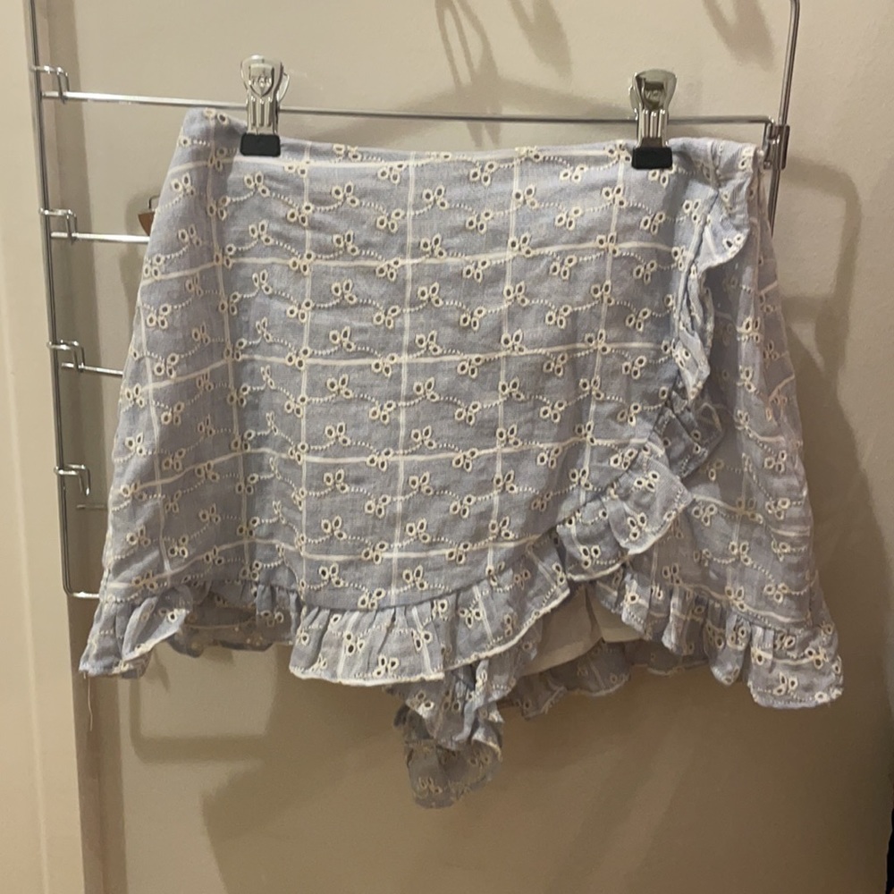 Baby blue and white floral mini skirt.